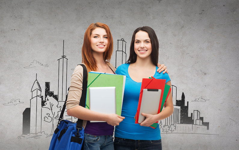 two smiling students with bag, folders and tablet